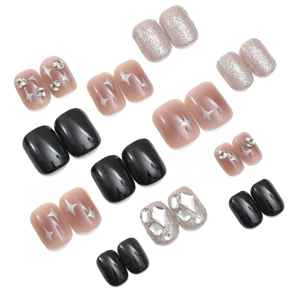 Set of 24 squoval press-on nails in various designs: black, ombre red with diamonds, and glitter dip with diamonds.